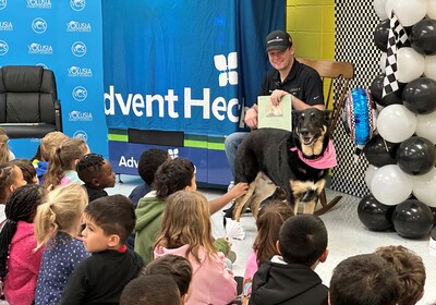 NASCAR Driver Reads to Children and Delivers a "Bookworm" Vending Machine to Volusia Elementary School